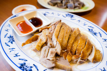 Slice of goose meat in plate at restaurant