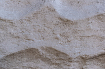 Grey, uneven textured surface made of cement screed