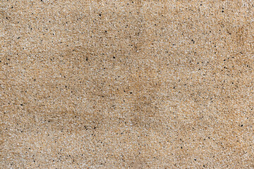 Solid, fine-grained, sand-colored wall surface