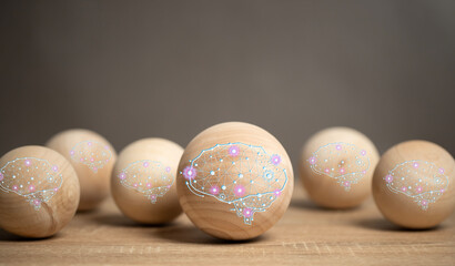 AI Brain Concept, an intelligent machine brain that processes by connecting to a network system. A wooden ball with an AI brain is placed on the table.