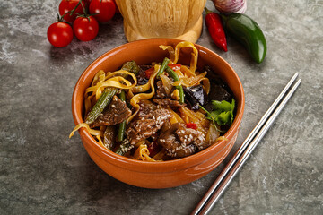 Asian wok with noodle, vegetables and beef