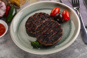 Grilled burger cutlet with sauce