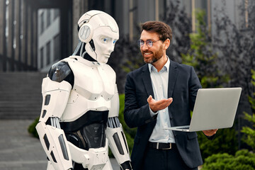 Robot with businessmen on the street near the building