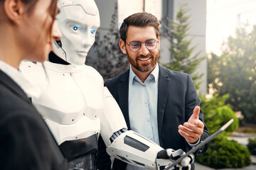 Robot with businessmen on the street near the building