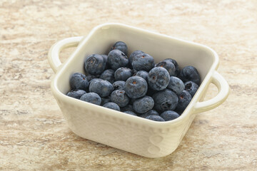 Sweet ripe blueberry heap in the bowl