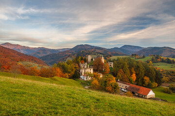 Autumn landscape with medieval castle of The Sklabina at sunset, Slovakia, Europe.