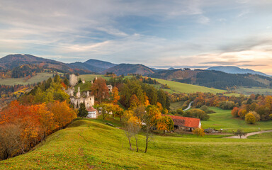 Obraz premium Autumn landscape with medieval castle of The Sklabina at sunset, Slovakia, Europe.