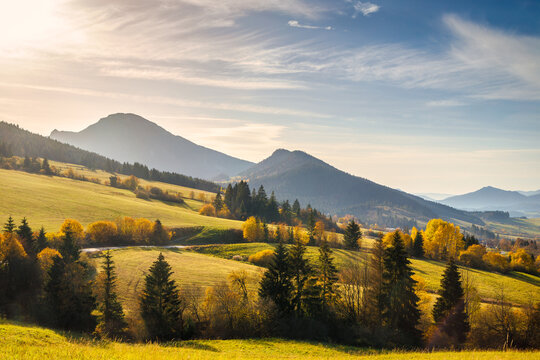 Autumn sunny rural landscape with mountains at background. The Orava region of Slovakia, Europe.