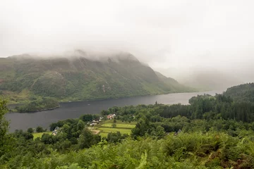 Foto op Plexiglas Glenfinnanviaduct Scenery with misty clouds above Loch Shiel and the hills, Glenfinnan, Scotland