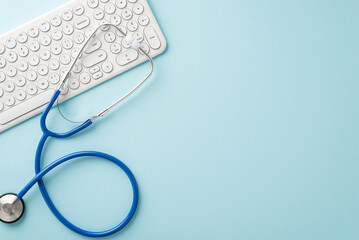 Experience modern healthcare through virtual visits. Top-down view of a pc keyboard and stethoscope...