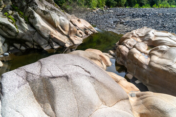 Exotic stones in a river in the jungle