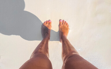 Sexy woman feet naked on the white beach sand Maldives. - obrazy, fototapety, plakaty