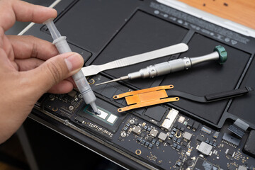 Disassembling a laptop, Repair and cleaning. The inside of the laptop is dirty.