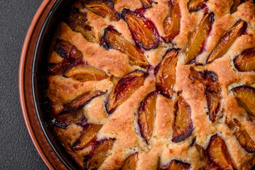 Delicious sweet aromatic homemade pie with ripe plums
