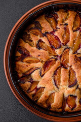 Delicious sweet aromatic homemade pie with ripe plums