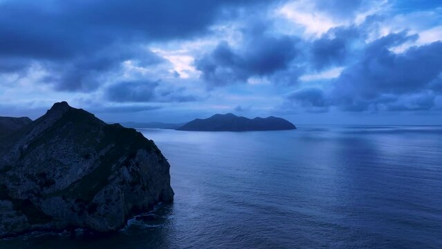 Sunset and Mount Buciero in the background. Surroundings of Mount Candina and the Liendo Valley. Aerial view from a drone. Marismas de Santo&ntilde;a Natural Park. Cantabrian Sea. Colindres, Cantabria, Spain