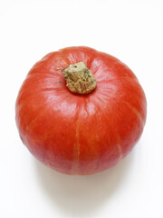 round orange pumpkin on white background