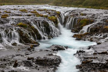 Fototapeta premium Bruarfoss - Bridge Falls - on Iceland's Golden Circle route under cloudy autumn sky.