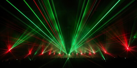 Lasershow background banner - Closeup of colorful red green laser beams rays in a club, disco,...