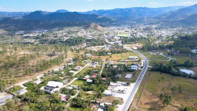 Aerial trip over a small town named Marcala with yellow sunset light