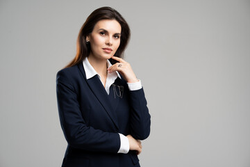 Fototapeta na wymiar Photo young intelligent marketing assistant businesswoman worker woman touch chin posing thinking serious face. Formalwear secretary job young girl.