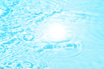 Defocus blurred transparent blue colored clear calm water surface texture with splashes reflection. Trendy abstract nature background. Water waves in sunlight with copy space. Blue watercolor shine.