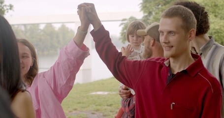 Naklejka premium Group therapy games enhance communication skills, including active listening, effective expression of feelings, empathy. Skills are valuable for building healthy relationships. People playing outside
