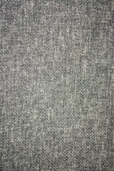 Gray fabric background. The background is dark gray fabric. Dark fabric grey background for base