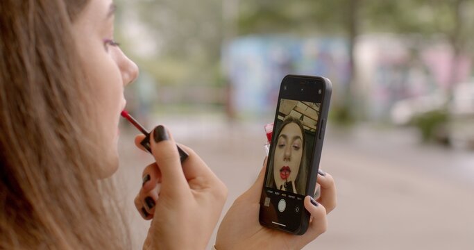 Girl doing makeup close. Body Dysmorphic Disorder. Individuals with BDD may engage in repetitive behaviors, grooming or mirror checking, in an attempt to alleviate distress related to their appearance