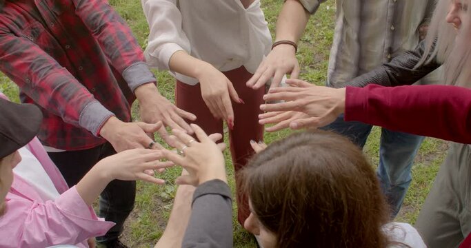 People hands close up, fingers movement, group somatic therapy to self-discovery, emotional healing, and personal growth, connection between body and mind. Ukranian refuges ptsd trauma psychotherapy