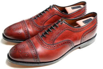 Classic men's dress shoes on a white background