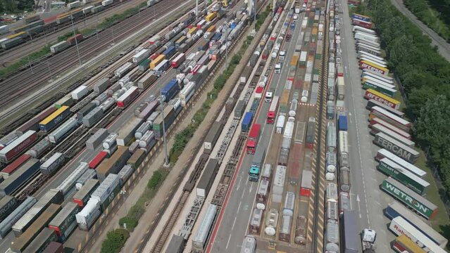 Aerial view of a road-rail transshipment terminal in Italy. The cargo begins its journey by train and is picked up by a truck to its final destination by road.