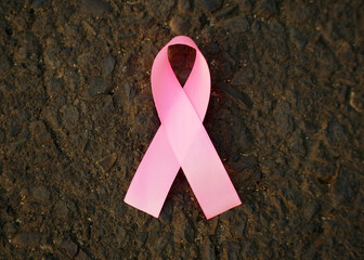 October Breast Cancer Awareness month. Pink ribbons on the wild grass