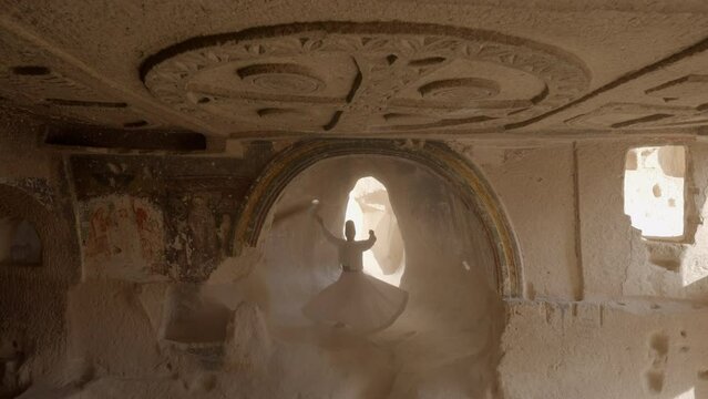 Lockdown Shot Of Man Doing Dervish Dance In Abandoned Building - Cappadocia, Turkey