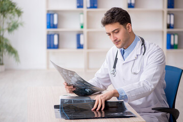 Young male doctor radiologist working in the clinic