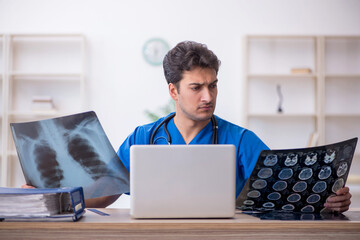 Young male doctor radiologist working in the clinic