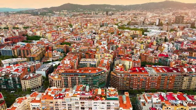 Aerial view of Barcelona Eixample district and Sagrada Familia Basilica, Spain. Barcelona street. Typical square quarters of Barcelona. Aerial view. Famous mediterranean destination in catalonia spain