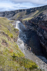 Naklejka na ściany i meble Waterfall in Markarfjotsgljufur Canyon in Fjallabak Nature Reserve in Iceland highlands on sunny autumn morning..