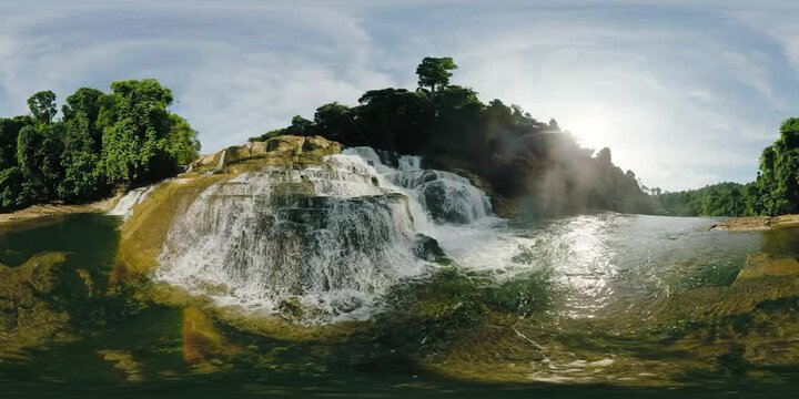 Misty falls with turqiouse water flowing over the multi-tiered rocks. Tinuy-an Waterfalls. Bislig, Surigao del Sur. Philippines. VR 360.