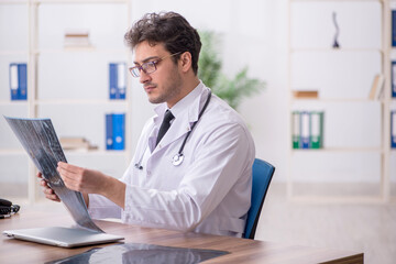 Young male doctor radiologist working in the clinic