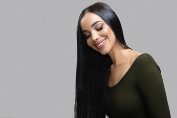 Fashion happy smiling woman with straight long shiny hair. Beauty and hair care