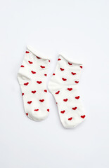 Pair of heart socks on white.