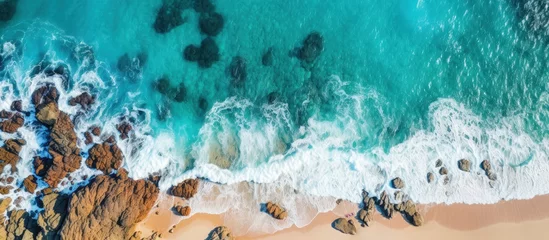 Foto op Plexiglas Drone captures stunning summer seascape with rocky coast and waves © AkuAku