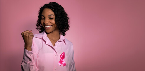 Breast cancer awareness concept. Copy space banner with happy confident african american happy...