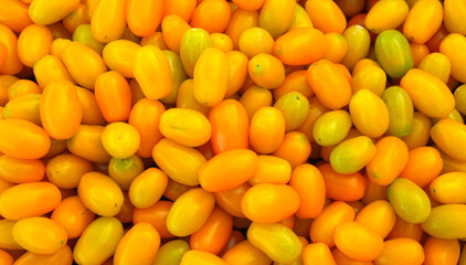 fresh juicy cherry tomato as food background