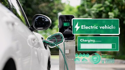 Electric car plug into EV charger cable from charging station display smart digital battery status hologram in eco green park and foliage background. Energy sustainability technological advance.Peruse