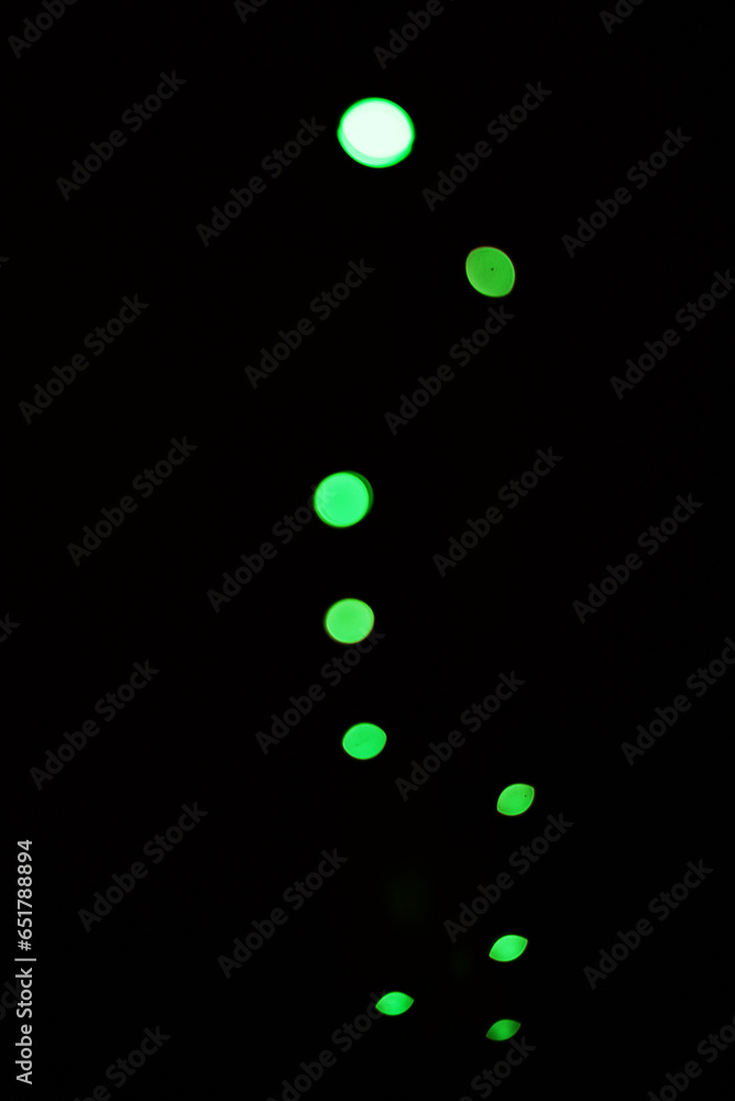 Poster green light, bokeh and glow on dark background isolated on a mockup space. blur, black backdrop and 