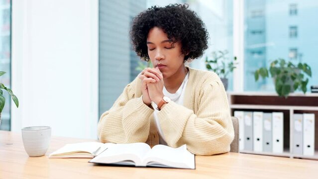 Business woman, praying and faith in office, bible study and notebook for religion, gratitude and peace at job. Lady, worship and praise with connection to God, meditation and holy spirit for guide