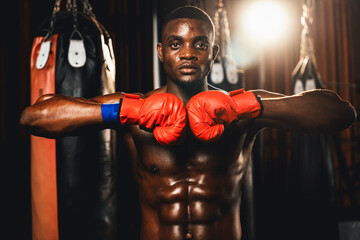 Boxing fighter posing, African American Black boxer put his hand or fist wearing glove together in...