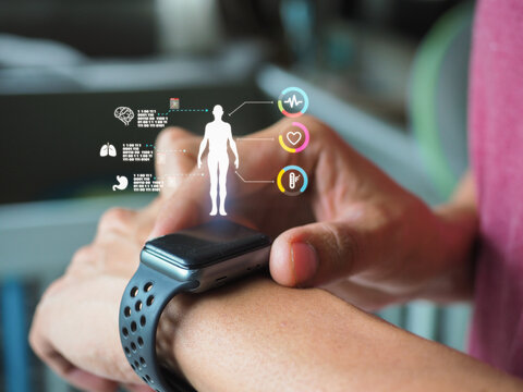 Mid adult man using smart watch during training. Heart monitor beats with wristwatch. smart watch or future data on healthcare. technology in use of smart watch for health condition.